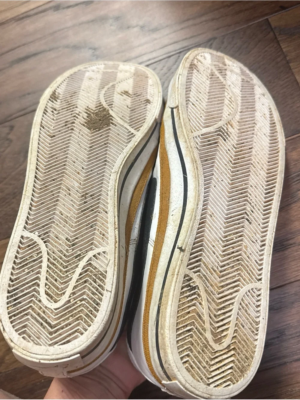 Nike White Low-Top Sneakers with Black Swoosh and Brown Trim